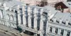 Фасад Дома Дунаева с четырьмя фигурами Геракла на проспекте Октября в Ярославле